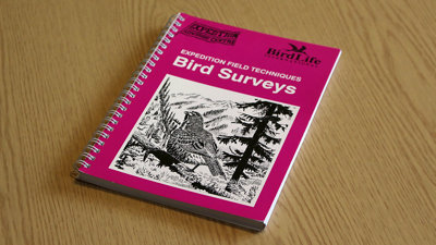 A copy of Expedition Field Techniques: Bird Surveys on a desk.