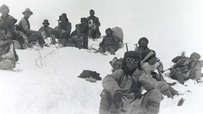  Team members including Mallory and Sherpas at a rest stop on Everest