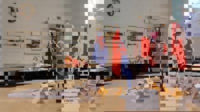 Table with flags representing different nations at COP event held in Education Centre