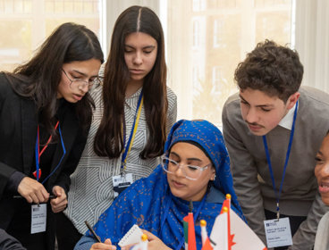 Group of five students working on a project.