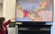 Presenter sharing her research on screen at a writing retreat.