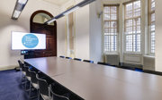 A small meeting room set-up in boardroom style. 