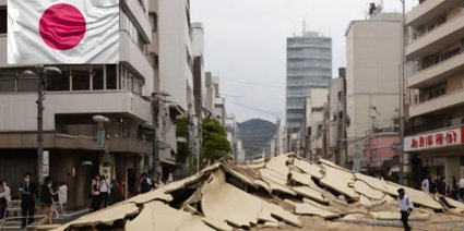 Earthquake damame in Japan, specifically a destroyed road in an urban area