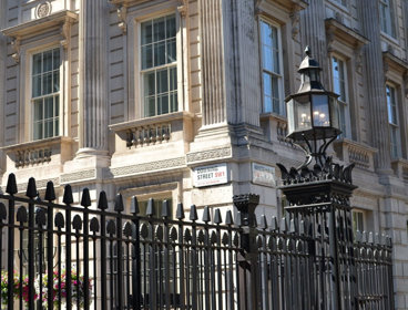 Black gates outside Downing Street in London.