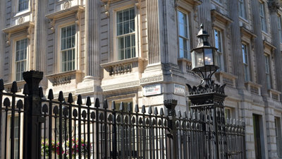 Black gates outside Downing Street in London.