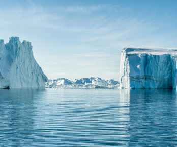 Towering glaciers and ocean in the Arctic.