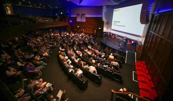 RGS Director Joe Smith welcomes attendees in the Ondaatje Theatre during the Explore 2024 opening address.