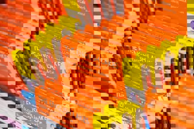 A selelction of orange covered Ordnance Survey maps