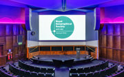 A stage-facing shot of the Ondaatje Lecture Theatre from the upper balcony level. 