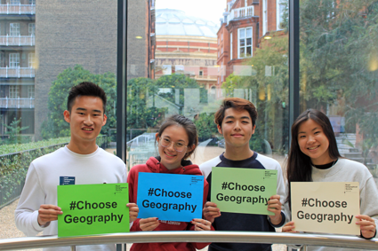 Four young people holding up signs with the text Choose Geography.