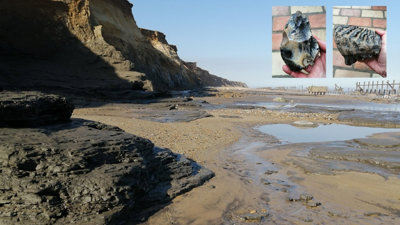 Coastline of Happisburgh with a long, stretched beach and cliffs.