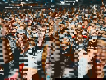 A crowd of people cheering