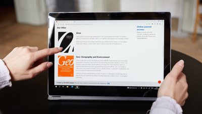 Tablet screen viewing Society's journal webpage 