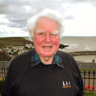 Rear Admiral Steve Ritchie standing by the coast.