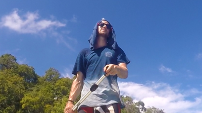 Daniel standing on a boat