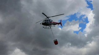 Firefighter helicopter in the air.