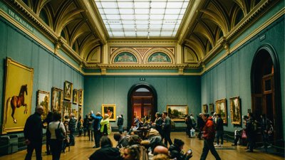 Busy gallery space with people.