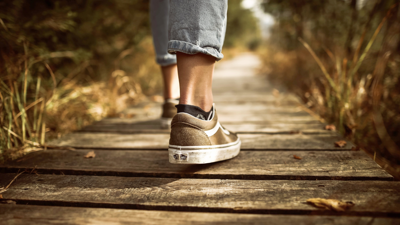 Close-up shot of shoes of someone walking. 