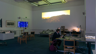 Person looking at the artist commission in Education Centre.