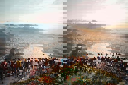 A crown of people at a view point in Rio