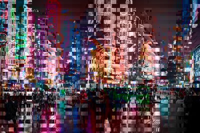 An urban chinses scene with people and neon lights