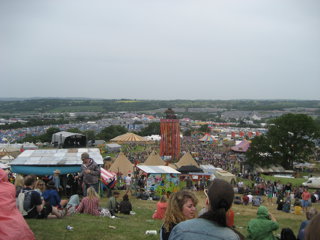 Figure 3: View of Glastonbury showing some of the impacts of festivals - big crowds, many buildings and litter scattered.