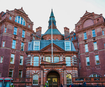 A red brick building with the words University College London on the front