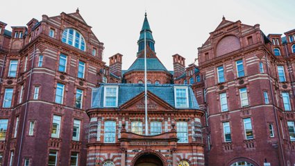 A red brick building with the words University College London on the front