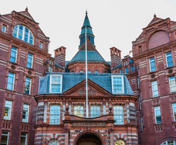 A red brick building with the words University College London on the front