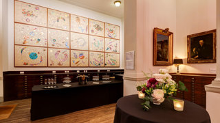 A bar set-up in the Map Room with champagne glasses for a formal reception.