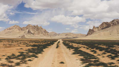 Road leading to mountains in a desert