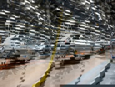 Cars being produced in a factory