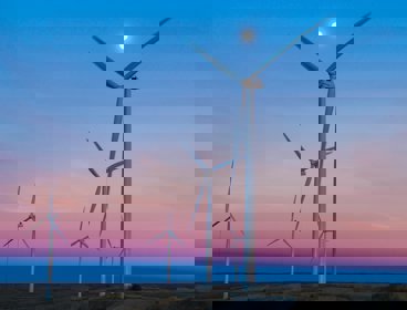 Wind turbines on a background of blue and purple evening sky