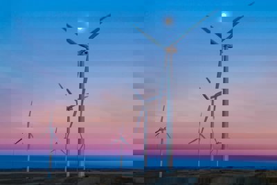 Wind turbines on a background of blue and purple evening sky