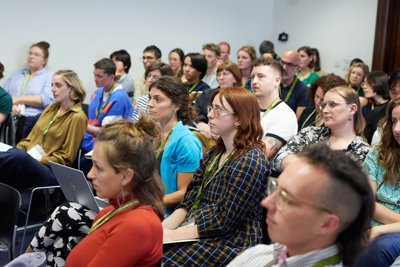 Audience watching conference presentation