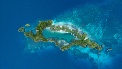Island with lush green vegetation and island with sea all around it. Rufas Island, Saukabu, Raja Ampat Regency, West Papua, Indonesia
