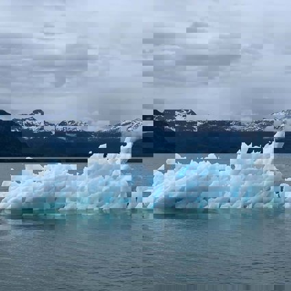 Antarctic scene with attractive blue glacier floating in the ocean