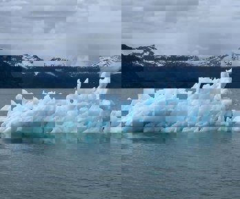 Antarctic scene with attractive blue glacier floating in the ocean