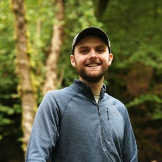 Cameron Mackay in a forest.