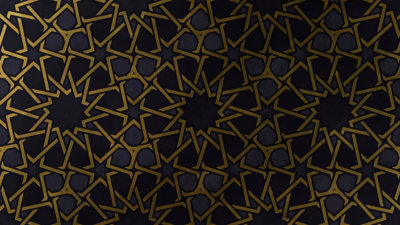 Symmetrical pattern of gold stars against a dark background.