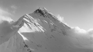 Old black and white photograph of Mount Everest.