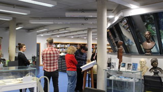Researchers take a tour and look at Collections material