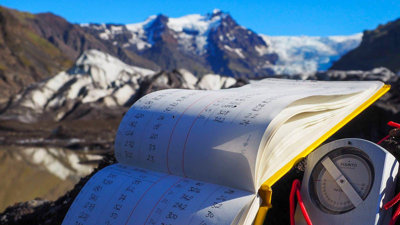A journal listing measurements taken on a mountain.