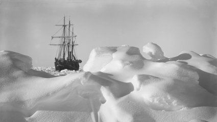 Historical black and white photograph of Endurance frozen in the ice.