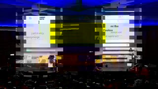 Poulomi Basu in Ondaatje Theare presenting on making art in emergency.