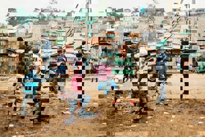 Children playing in brown sand