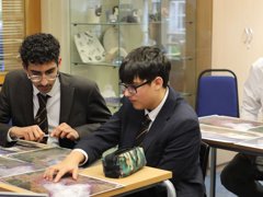 Two students looking at glacier satellite images.