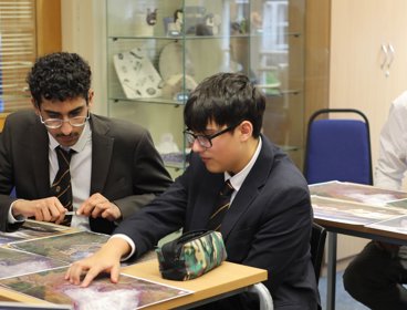 Two students looking at glacier satellite images.