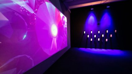 Shot of exhibition space with pink lighting.