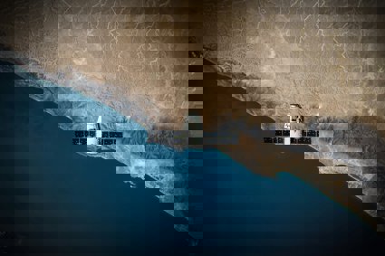 A space satellite above a coastline
